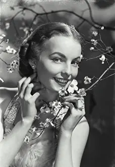 Gorgeous Prints: Vintage photograph. Portrait of woman in dress smiling in dogwood branches