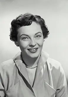 Lipstick Prints: Vintage photograph. Portrait of Woman with short hair smiling at camera