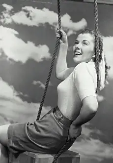 Dreaming Prints: Vintage photograph. Portrait of woman sitting on box swing
