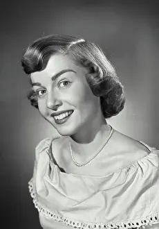 Tilted Prints: Vintage photograph. Portrait of woman smiling with head tilted