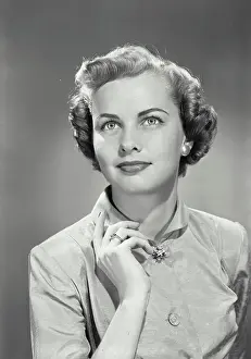 Vintage photograph. Portrait of young woman looking up