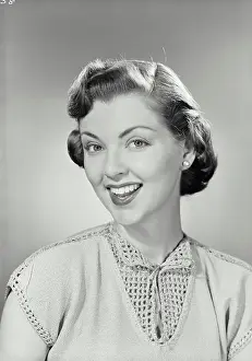 Vintage photograph. Portrait of young woman smiling. Model released