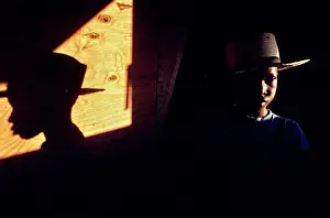 Contrast Prints: Vintage Photograph. Shadow play: a boy's silhouette contrasts against warm sunlight