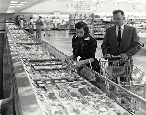 Purchase Prints: Vintage Photograph. Shopping for meat at the supermarket