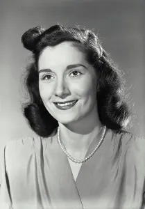 Medium Length Prints: Vintage Photograph. Smiling brunette woman wearing blouse and beaded necklace