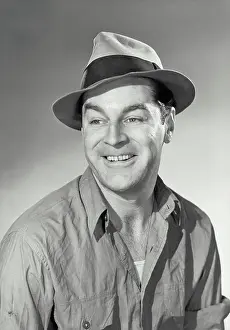 Wrinkled Prints: Vintage photograph. Smiling man wearing wrinkled shirt and disheveled hat
