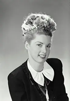 Wearing Flowers Prints: Vintage Photograph. Studio portrait of beautiful woman in jacket and earrings with flower headband