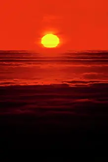 Glowing Prints: Vintage Photograph. Sunset serenity: capturing the perfect red sky horizon