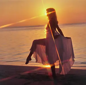 Ethereal Prints: Vintage Photograph. Sunset silhouette: tranquility on the beach with a glowing horizon
