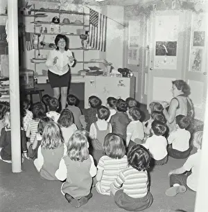 Attentive Prints: Vintage Photograph. A teacher singing in a small elementary school class