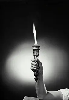 Frame Prints: Vintage Photograph. Torch with flame held up by male hand, Frame 7