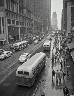 New York City Prints: Vintage photograph. Traffic on 42nd Street looking west from Grand Central Terminal on rainy day