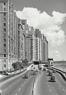 New York City Prints: Vintage photograph. View of Cars driving on FDR Drive by East River, looking north