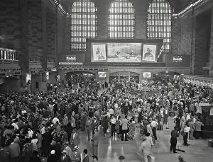 New York City Prints: Vintage photograph. View looking at Kodak Exhibit sign behind crowd of people at a busy Grand Central Station