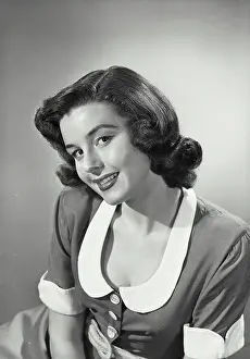 Stewart Prints: Vintage photograph. Woman in collared and button blouse smiling at camera