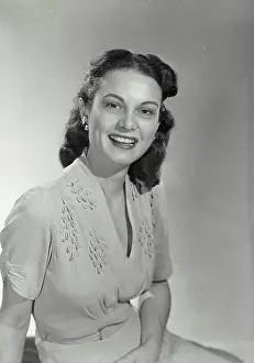 Iris Prints: Vintage photograph. Woman with dark hair smiling