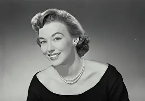 Blouse Prints: Vintage Photograph. Woman in low cut blouse and pearl necklace smiling wide at camera