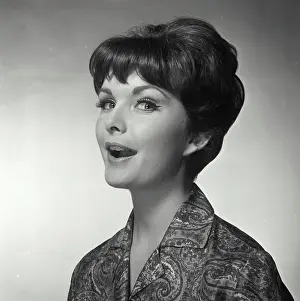 Chic Prints: Vintage Photograph. A woman with her mouth open facing to the left of frame looking at the camera
