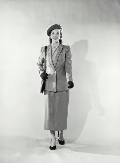 Heels Prints: Vintage photograph. Woman in outerwear smiling at camera