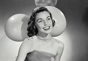Covered Prints: Vintage Photograph. Woman at party in front of balloons covered in confetti