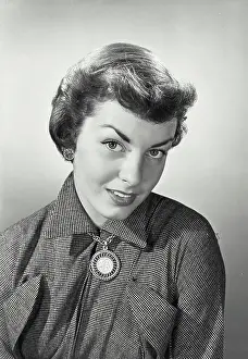 Collar Prints: Vintage photograph. Woman with short hair looking up at camera