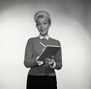 Notes Prints: Vintage Photograph. Woman smiles while taking notes