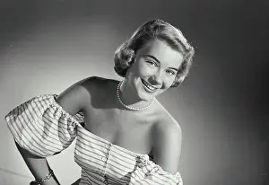 Medium Length Hair Prints: Vintage Photograph. Woman in striped blouse smiling wide at camera