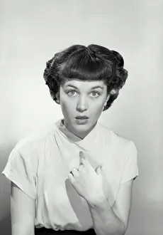 Facial Expression Prints: Vintage Photograph. Woman in v-cut blouse pointing at herself with eyebrows raised