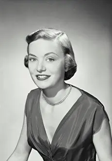 Lipstick Prints: Vintage photograph. Woman in v-cut dress smiling at camera