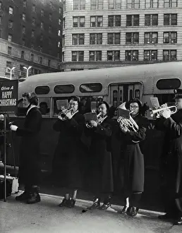 Brass Prints: Vintage Photograph. Women on street performing during holidays