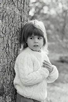 Sweater Prints: Vintage Photograph. A young girl leaning against a tree