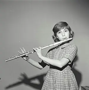 Lips Prints: Vintage Photograph. Young Girl Playing the Flute