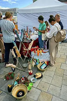 Visitor Prints: Visitors and ceramic figures at the pottery and handicraft market