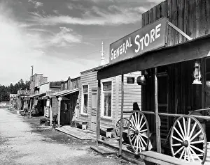 Hills Prints: Wagon wheels in front of a store, Gold Town, Black Hills, South Dakota, USA