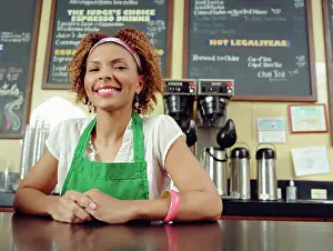 Beverage Prints: Waitress smiling at counter in coffee shop