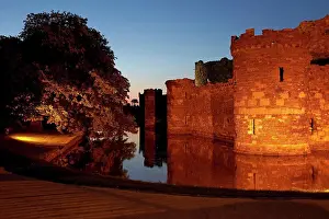 Defense Prints: Wales, Anglesey, Beaumaris. Beaumaris Castle and moat at dusk