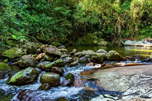 Hike Prints: Waterfall between rocks in the rainforest Waterfall between rocks in the rainforest of Ilhabela on the north coast of