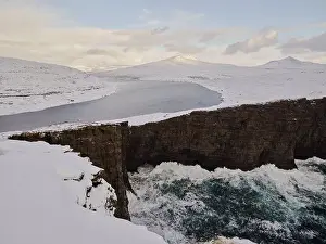 Archipelago Prints: Waves hit against cliffs near Leitisvatn lake in the Faroe Islands