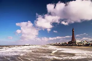 Waves in the sea with a tower in the background, Blackpool Tower, Blackpool, Lancashire England