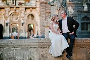 Husband Prints: wedding couple siting on oldest monument on city Lviv wedding couple siting on oldest monument on city Lviv
