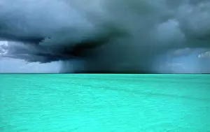 Caribbean Prints: West Indies, Turks and Caicos Island, Storm clouds over turquoise sea