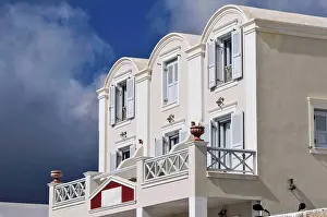 Balcony Prints: A white house with open shutters on windows; Fira