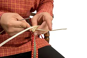 Produce Prints: Wickerwork. Studio photo of craftsman makes basket, close-up