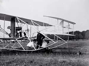 Early 1900s Prints: Wilbur Wright, Orville Wright and Charlie Taylor putting the plane on launching rail Fort Myer Virginia circa 1909