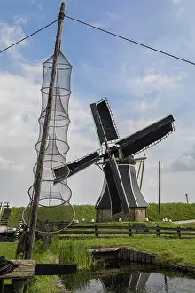Windmill in a reconstruction of a 19th century Dutch fishing village at the Zuiderzee Open Air Museum in the Netherlands
