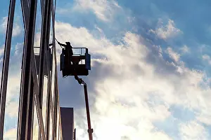 Windows Prints: Window cleaner cleaning the windows of a hotel, Berlin, Germany, Europe
