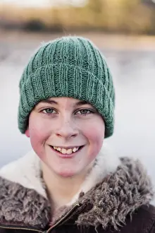 Freezing Prints: winter portrait of smiling 10 year old boy with a woolly hat