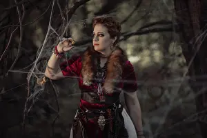 26 29 Years Old Prints: Witch with short hair in dress against the background of wild nature
