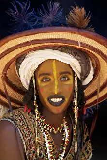 Identity Prints: Wodaabe Bororo man with his face painted at the annual Gerewol male beauty contest