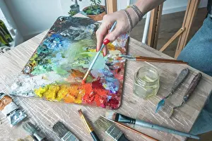 Student Prints: woman artist mixing paint on palette